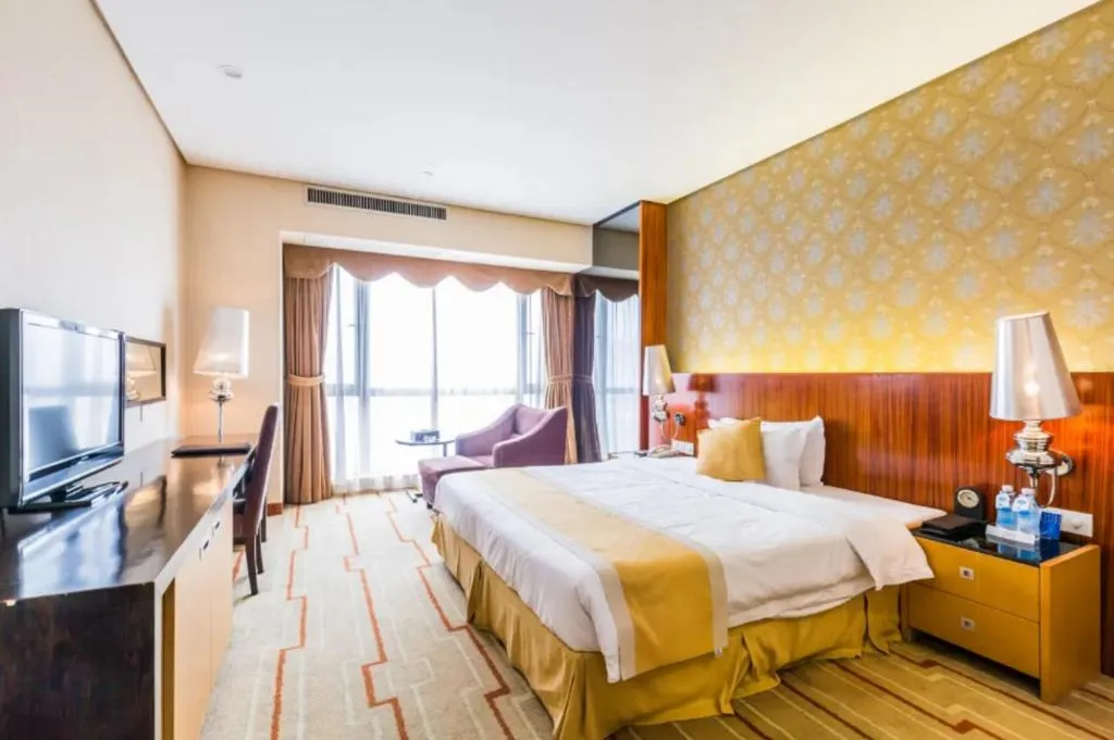 Bed in Foshan Nanhai Huifeng Holiday Hotel