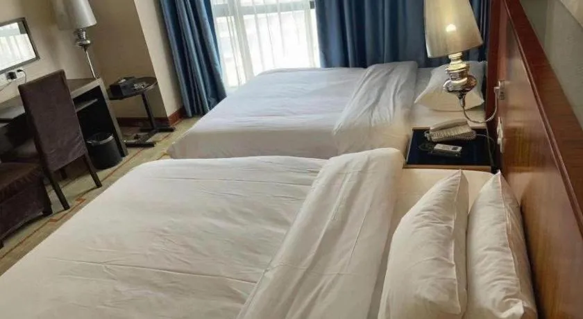 Bed in Foshan Nanhai Huifeng Holiday Hotel