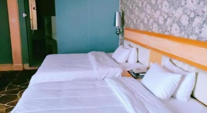 Bed in Foshan Nanhai Huifeng Holiday Hotel