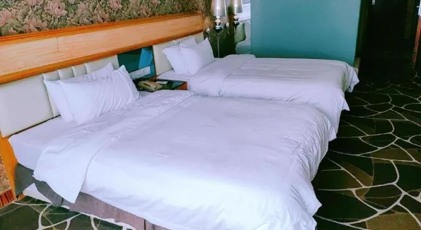 Bed in Foshan Nanhai Huifeng Holiday Hotel