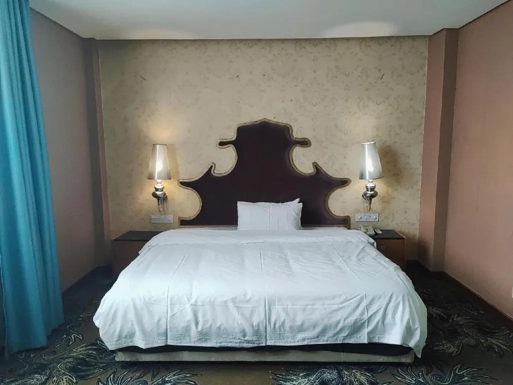 Bed in Foshan Nanhai Huifeng Holiday Hotel