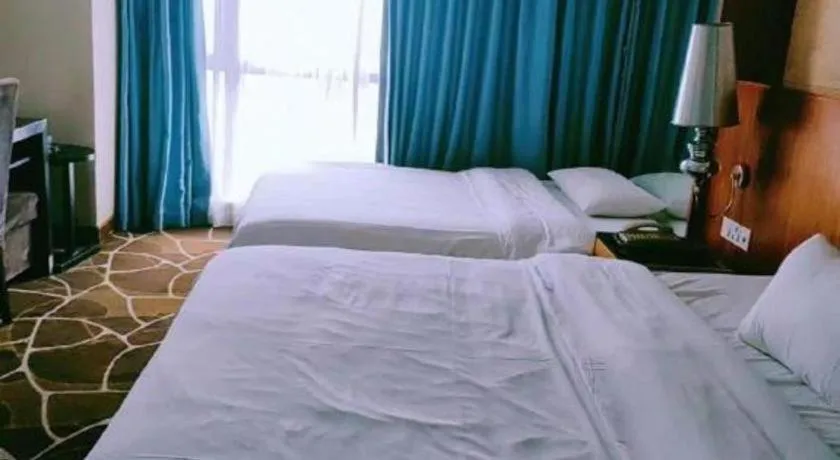 Bed in Foshan Nanhai Huifeng Holiday Hotel