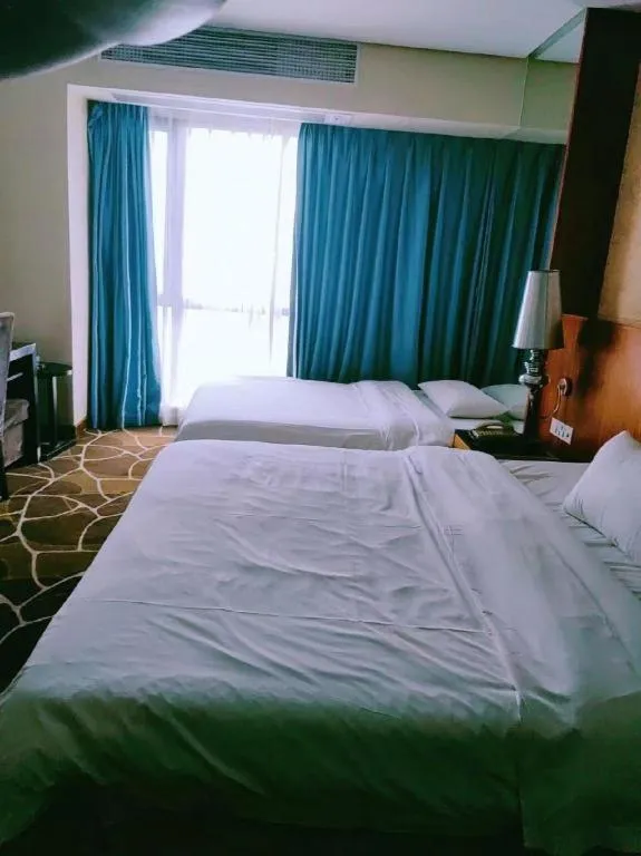Bed in Foshan Nanhai Huifeng Holiday Hotel