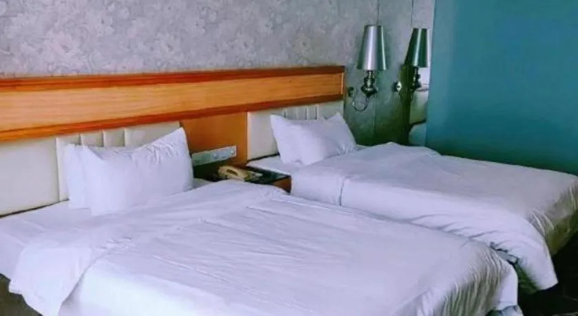 Bed in Foshan Nanhai Huifeng Holiday Hotel