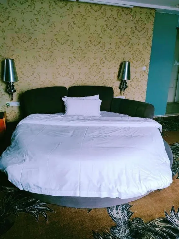 Bed in Foshan Nanhai Huifeng Holiday Hotel