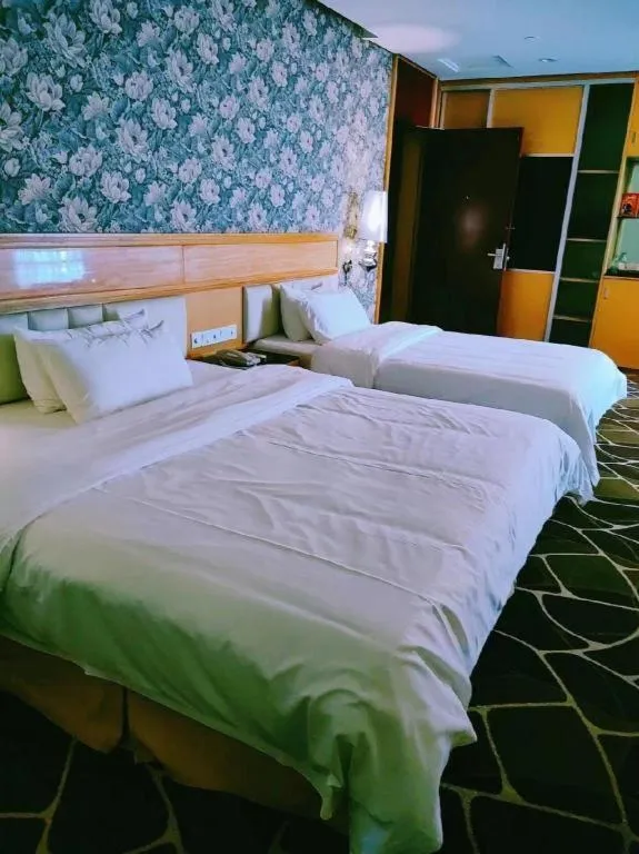 Bed in Foshan Nanhai Huifeng Holiday Hotel