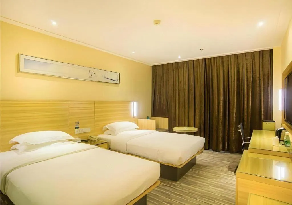 Bed in City Comfort Inn Liuzhou Chengzhong Wanda Plaza