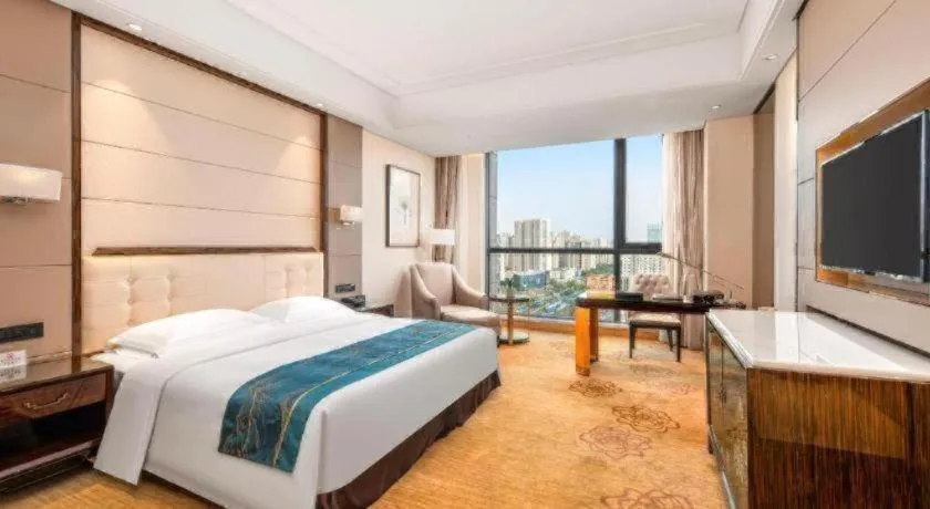 Bed in Jin Jiang Mingcheng Hotel