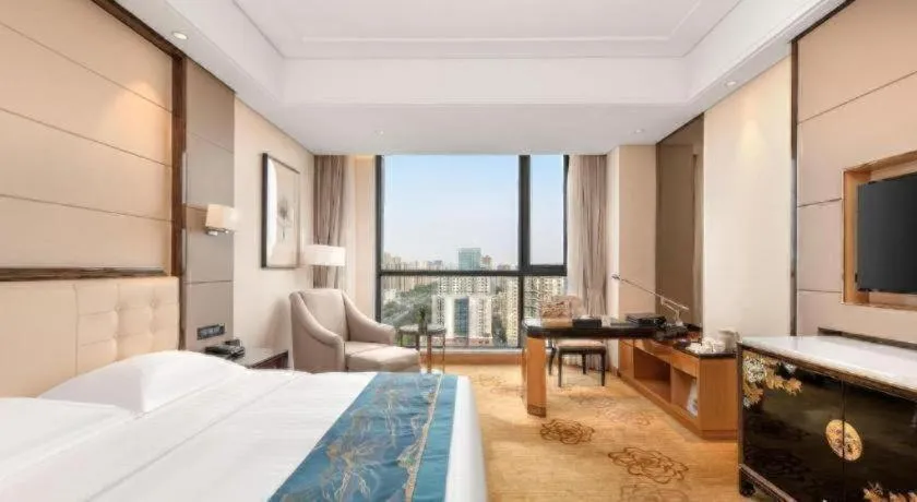 Bed in Jin Jiang Mingcheng Hotel