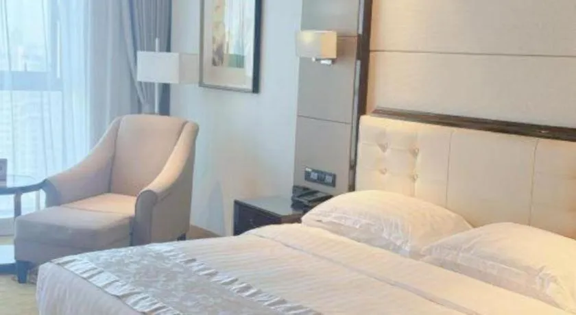 Bed in Jin Jiang Mingcheng Hotel