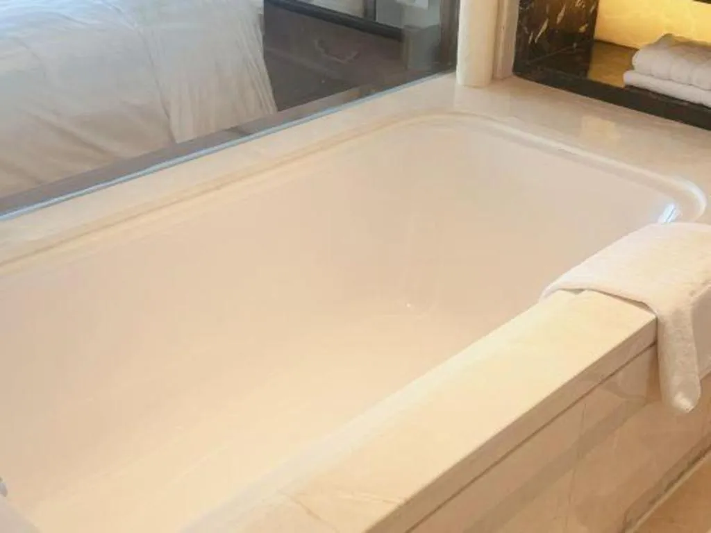 Bed in Jin Jiang Mingcheng Hotel