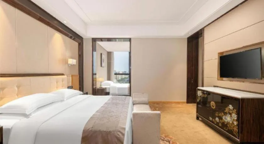 Bed in Jin Jiang Mingcheng Hotel