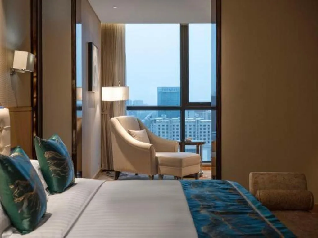 Bed in Jin Jiang Mingcheng Hotel