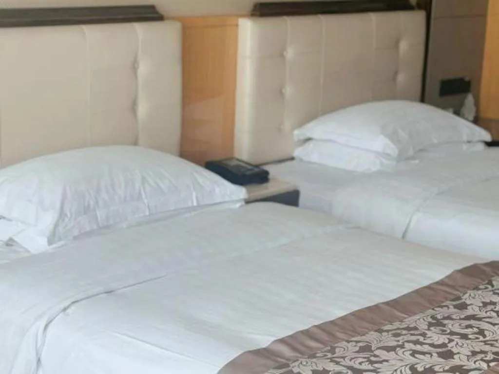 Bed in Jin Jiang Mingcheng Hotel
