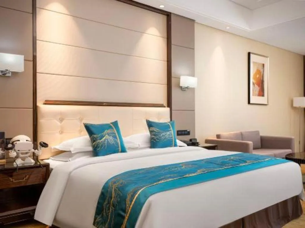 Bed in Jin Jiang Mingcheng Hotel