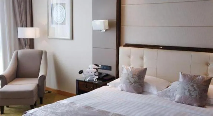 Bed in Jin Jiang Mingcheng Hotel