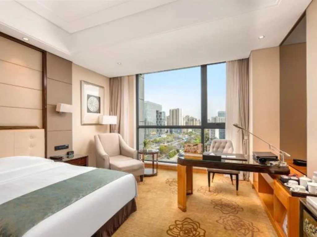 Bed in Jin Jiang Mingcheng Hotel