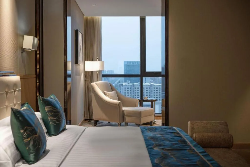 Bed in Jin Jiang Mingcheng Hotel