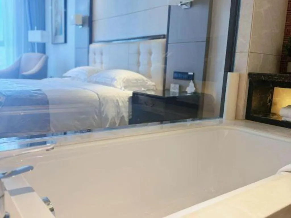 Bed in Jin Jiang Mingcheng Hotel