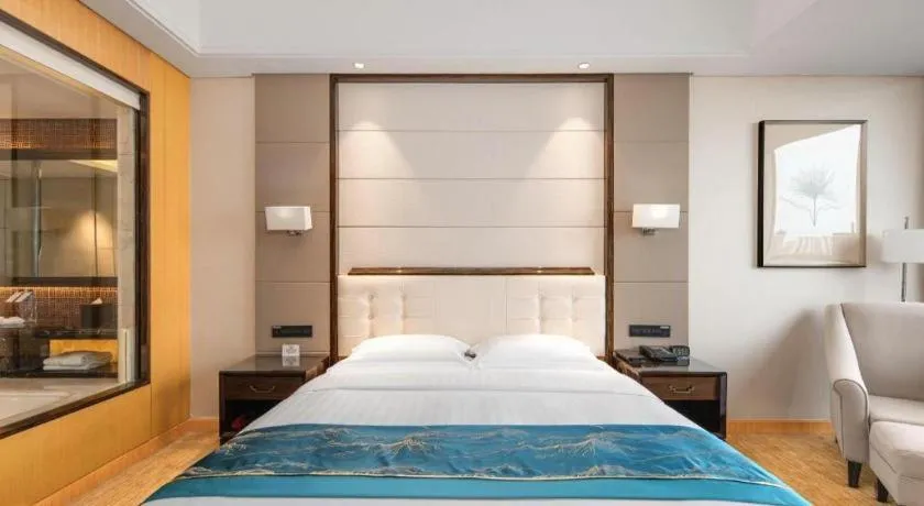 Bed in Jin Jiang Mingcheng Hotel