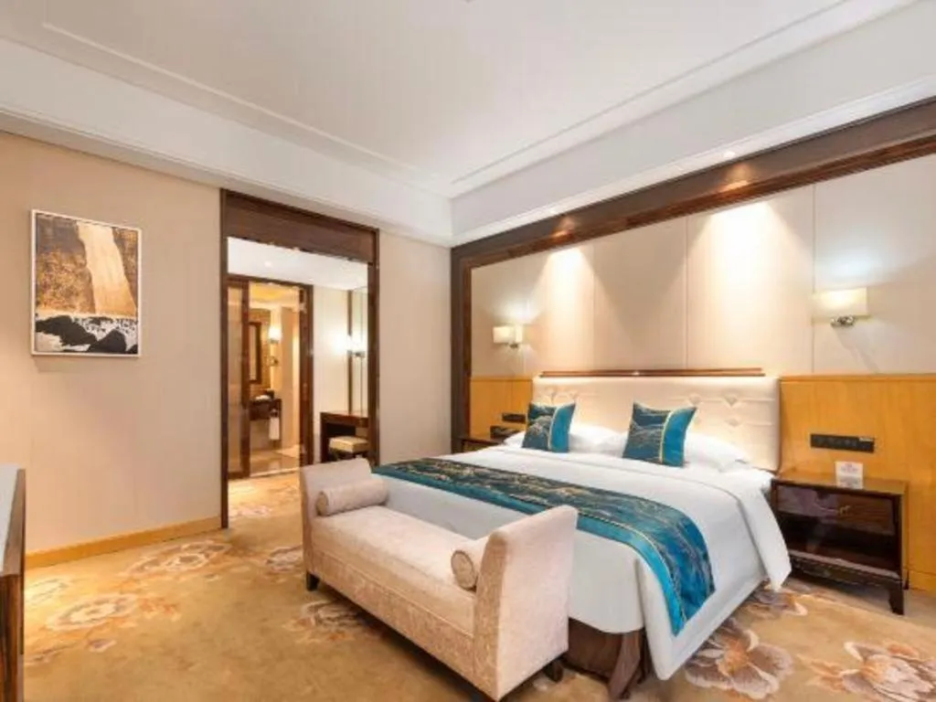 Bed in Jin Jiang Mingcheng Hotel