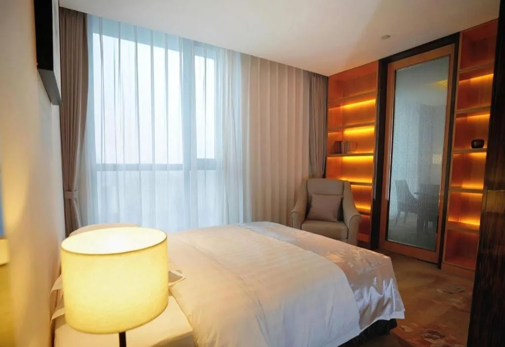 Bed in Jin Jiang Mingcheng Hotel