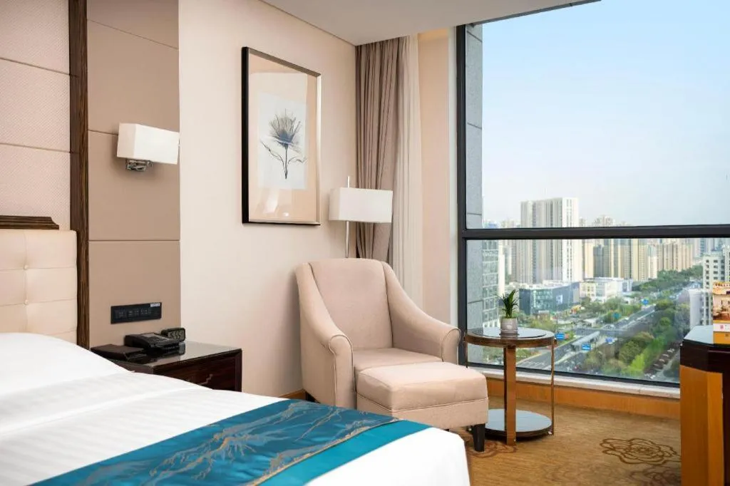 Bed in Jin Jiang Mingcheng Hotel