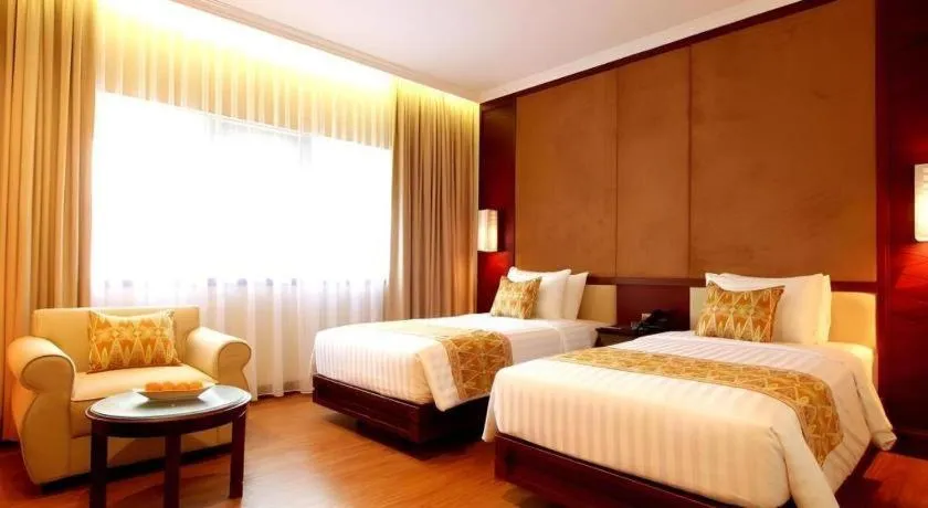 Bed in Kartika Chandra Hotel