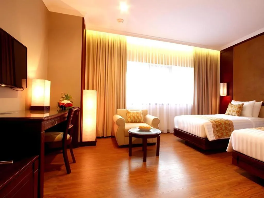 Bed in Kartika Chandra Hotel