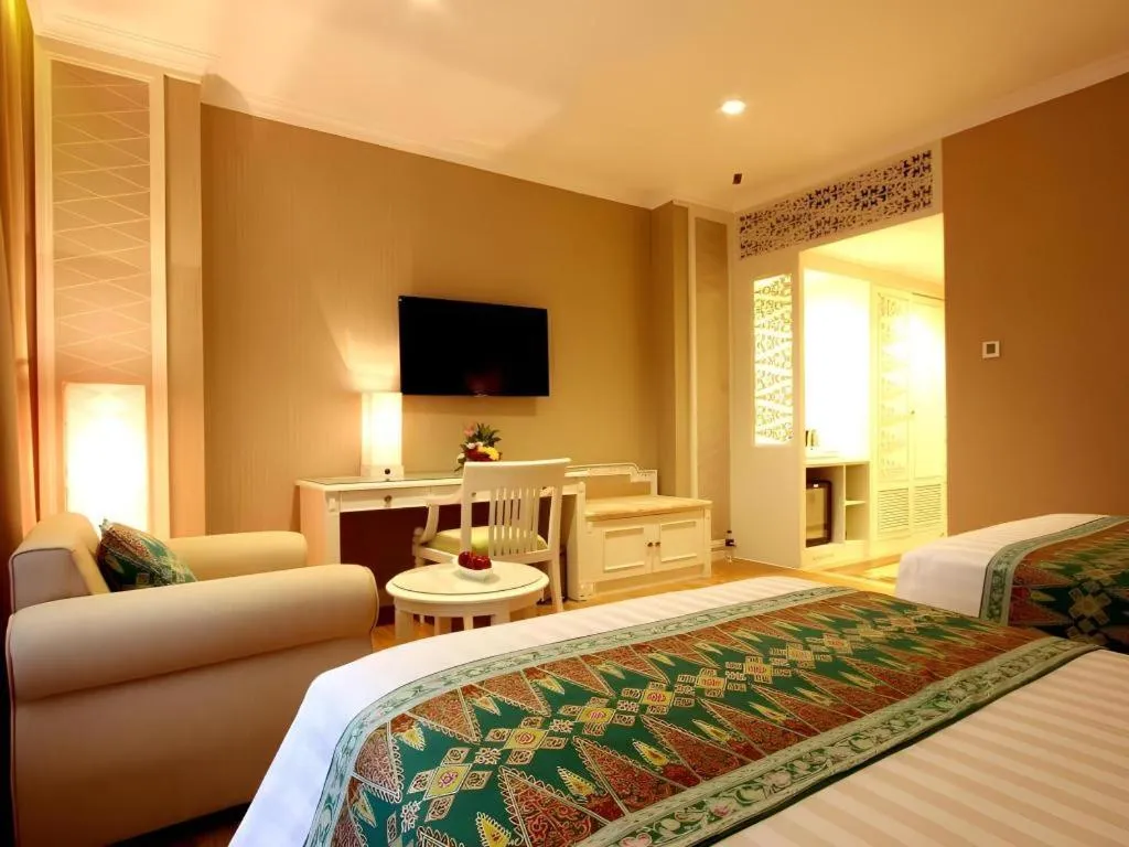 Bed in Kartika Chandra Hotel