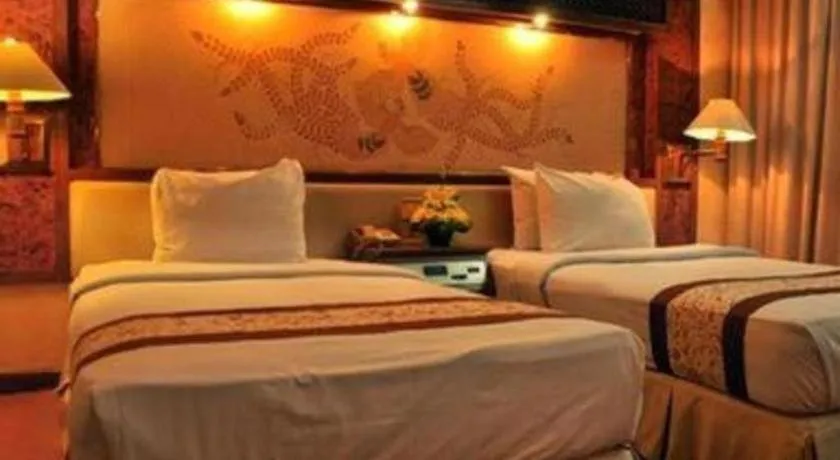 Bed in Kartika Chandra Hotel