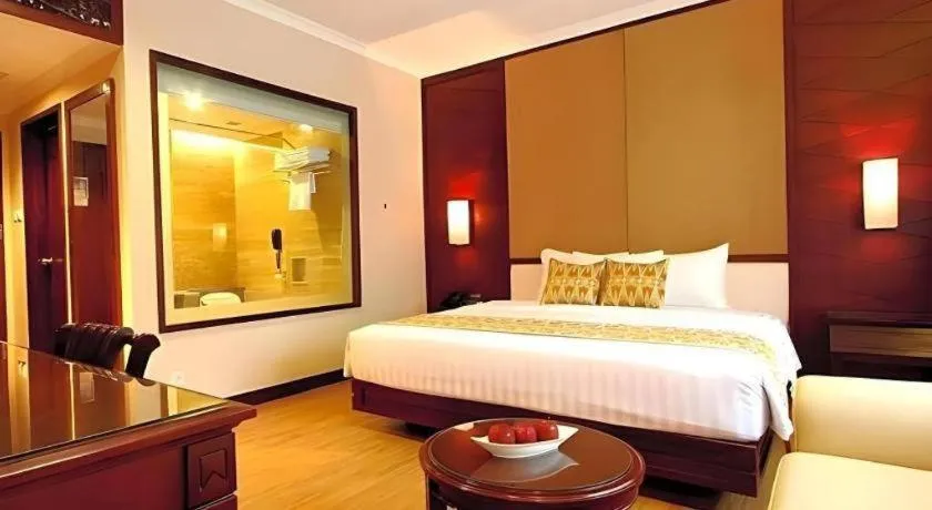 Bed in Kartika Chandra Hotel