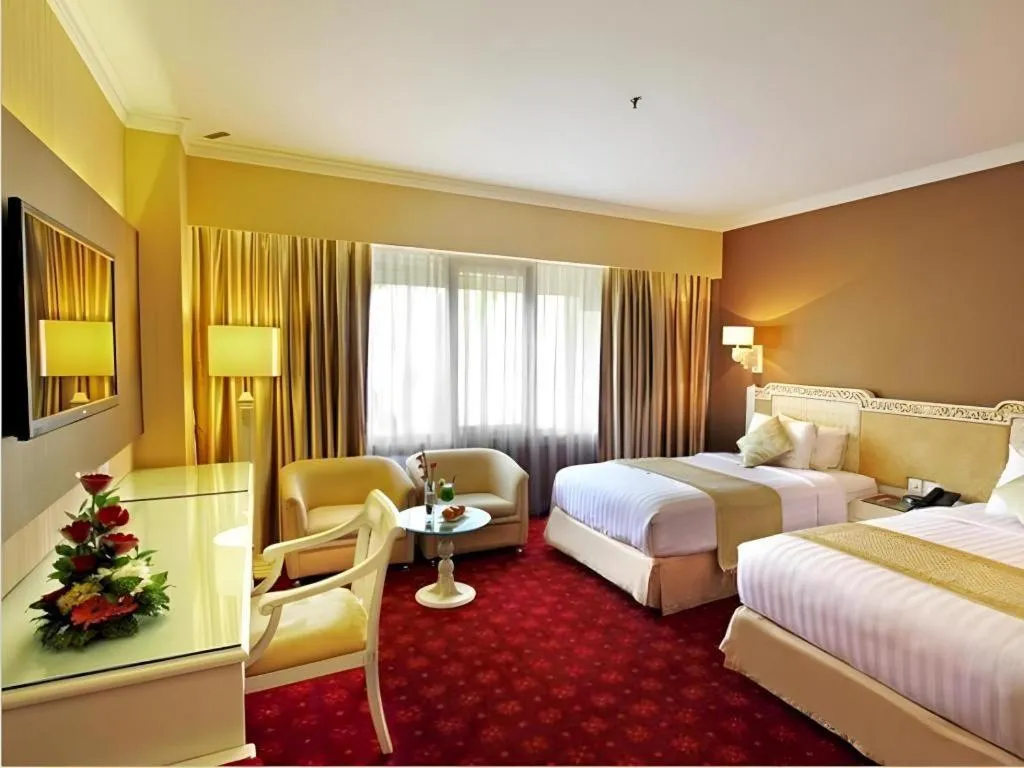 Bed in Kartika Chandra Hotel