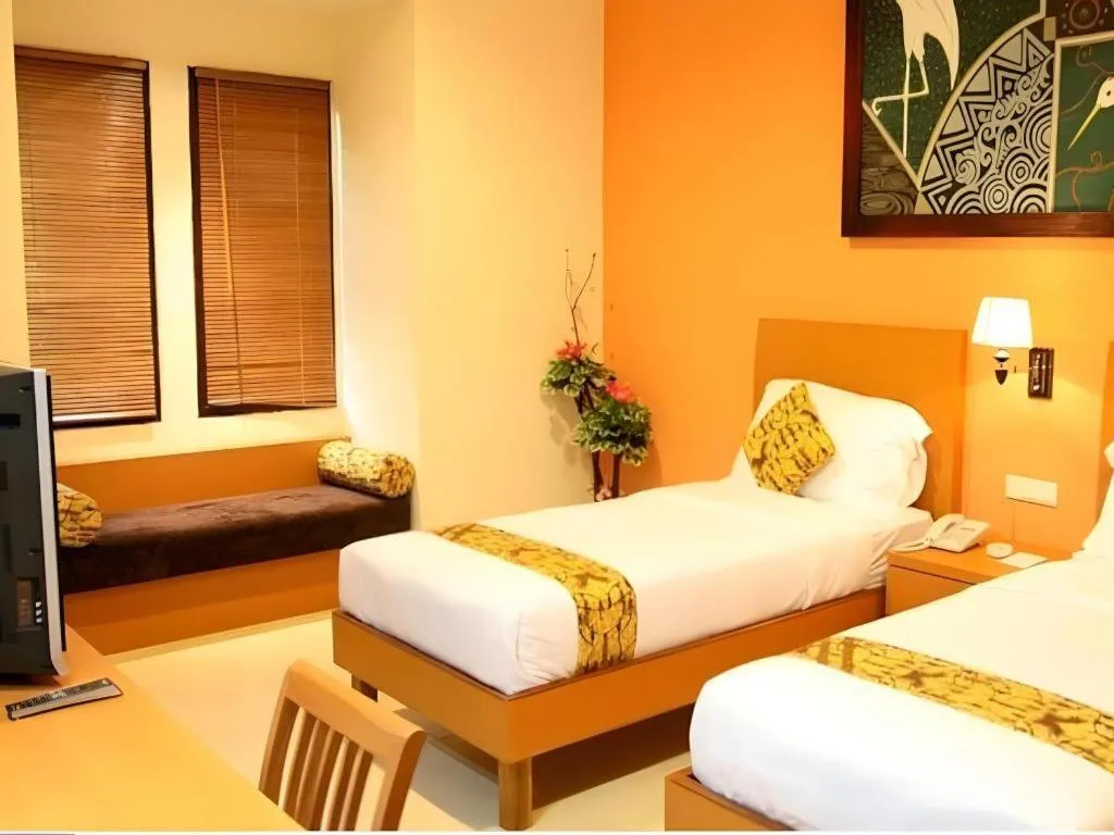 Bed in The Luxio Hotel