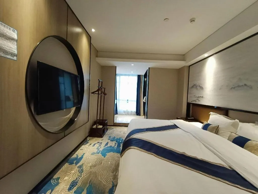 Bed in Yuan Culture Hotel Shenzhen World Shajing