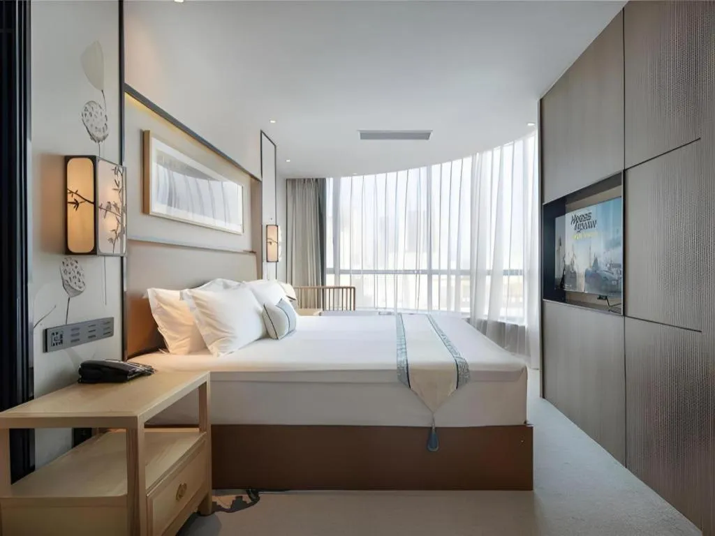Bed in Yuan Culture Hotel Shenzhen World Shajing