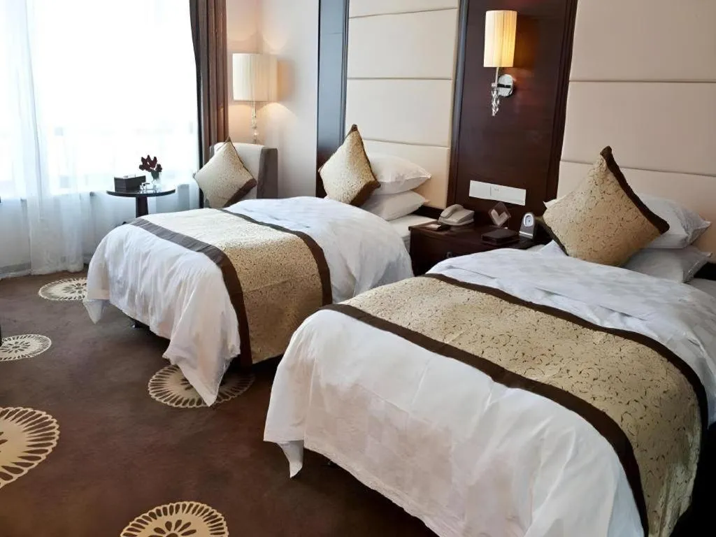 Bed in Hotel Ramada Plaza Hangzhou Xiaoshan