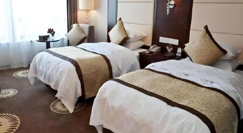 Bed in Hotel Ramada Plaza Hangzhou Xiaoshan