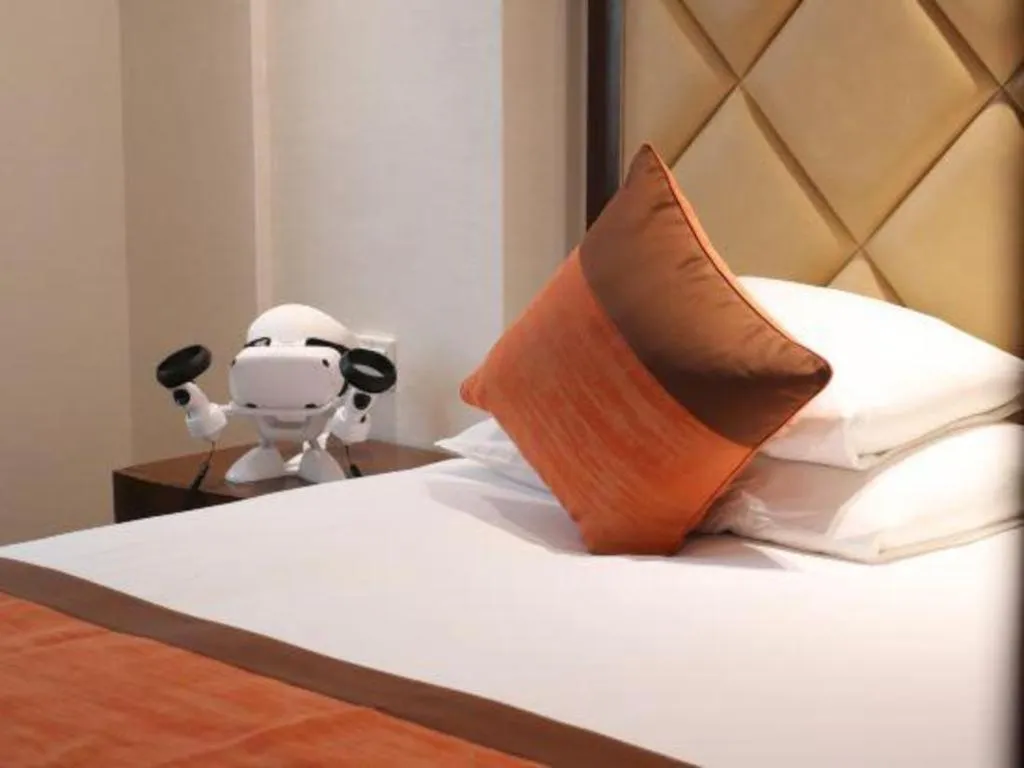 Bed in New Century Shaoxing Grand Hotel