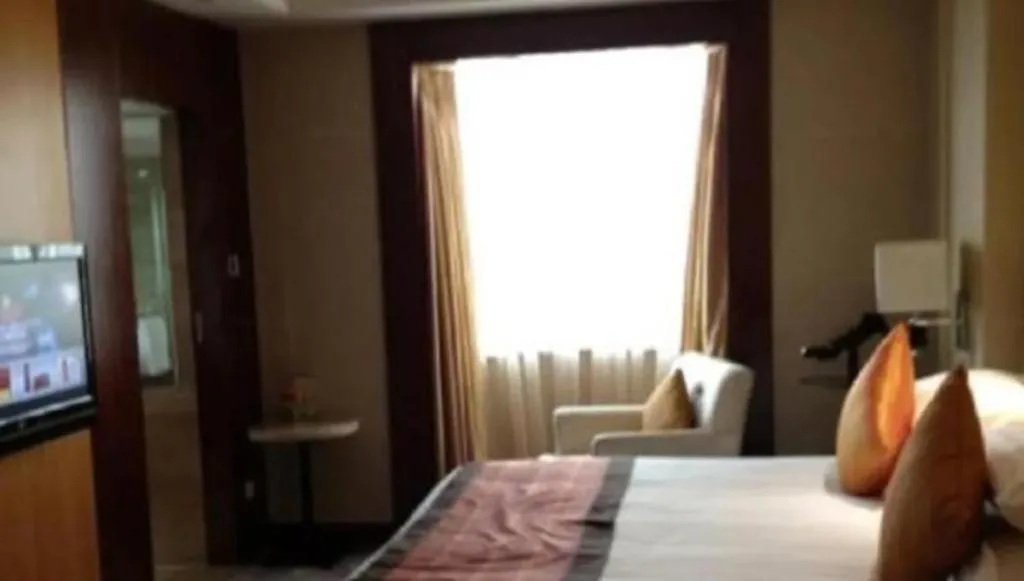 Bed in New Century Shaoxing Grand Hotel