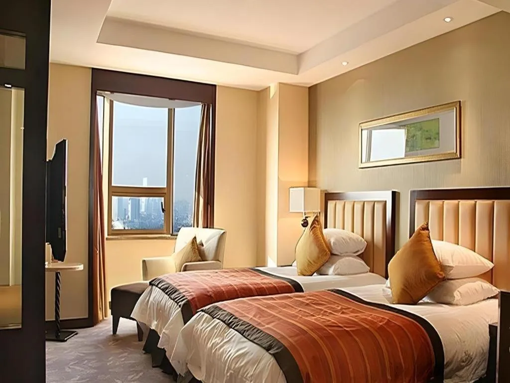 Bed in New Century Shaoxing Grand Hotel
