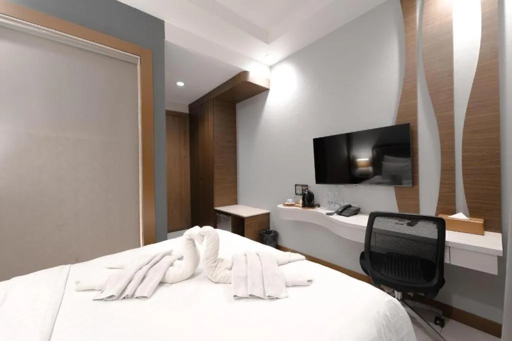 Bed in Sawana Suites