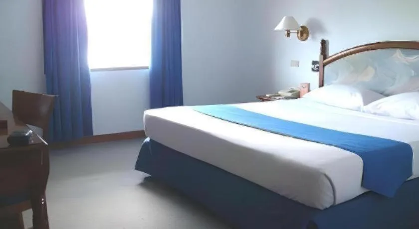 Bed in Sahid Kawanua Hotel