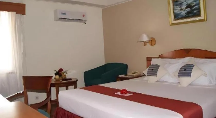 Bed in Sahid Kawanua Hotel