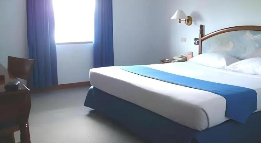 Bed in Sahid Kawanua Hotel