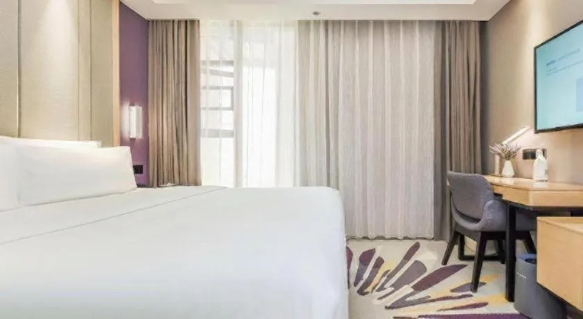 Bed in Lavande Hotel·Xishuangbanna Jinghong Songkran Square