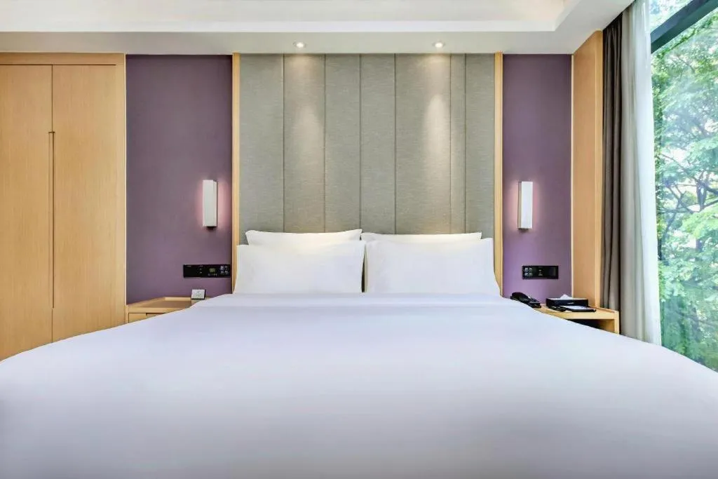 Bed in Lavande Hotel·Xishuangbanna Jinghong Songkran Square