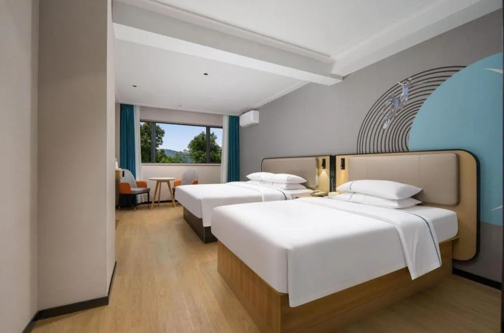 Bed in City Comfort Inn Chibi Railway Station