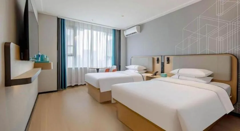 Bed in City Comfort Inn Nanning Guangxi University