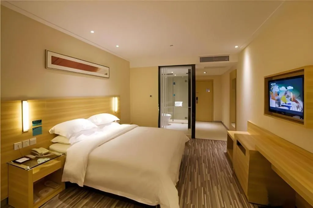 Bed in City Comfort Inn Zhongshan Shaxi Starbao Rosewood Expo City